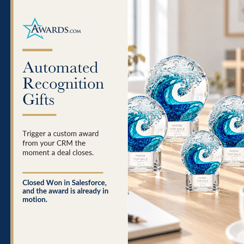 Clear art glass award on a crystal base on an office desk