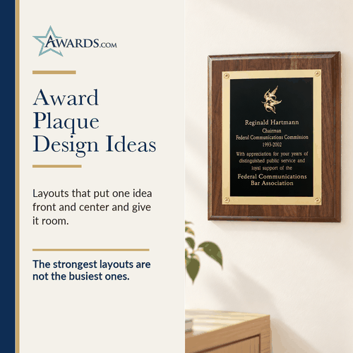 Walnut award plaque with a gold edged engraved plate on a wall