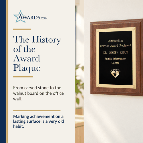 Walnut finish award plaque with rosettes on an office wall